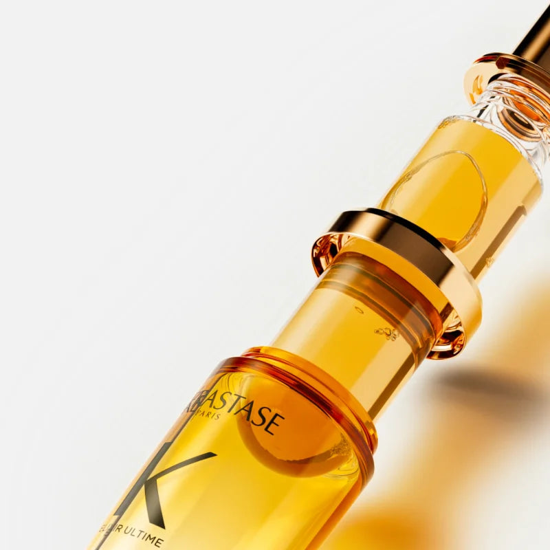 Luxurious Kérastase Elixir Ultime oil in a sleek bottle, perfect for nourishing and shining hair.