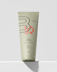 Tube of body lotion with BODIQ branding on a white background
