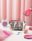 Sister's Aroma Cosmetic bag in metallic finish displayed on a table with beauty products, creating a chic and functional vibe.
