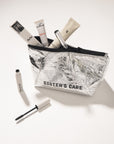 Sister's Aroma Cosmetic bag in silver, filled with beauty products, showcasing functional beauty on the go.