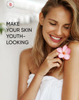 Woman holding a pink flower with text 'Make your skin youth-looking' on a blurred background