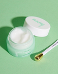 Rare Paris Elixir Intense Eye Serum in mint jar with applicator, promoting hydration and skin elasticity.