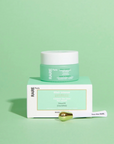 Rare Paris Elixir Intense Eye Serum with golden applicator on a green background, enhancing eye skin nourishment.