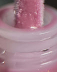 Instytutum Fancy Match Lip Gloss 3,5ml applicator with soft pink gloss, showcasing a smooth texture and shine.