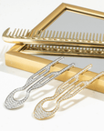 Fiona Franchimon Nº1 HAIRPIN Steel with Swarovski® Crystals | Yellow Gold Finish displayed with silver hairpin and comb.