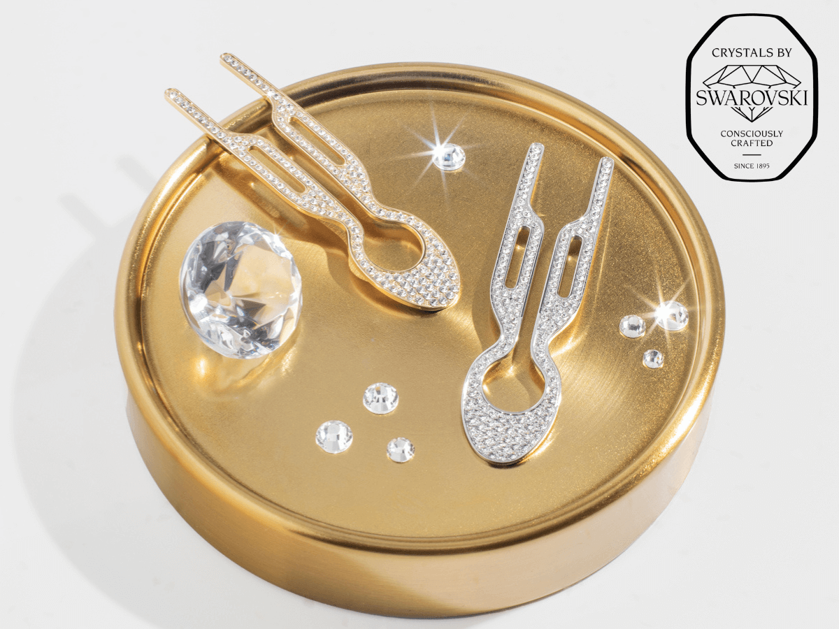 Fiona Franchimon Nº1 HAIRPIN Steel with Swarovski® Crystals | Yellow Gold Finish on a golden surface with crystals.