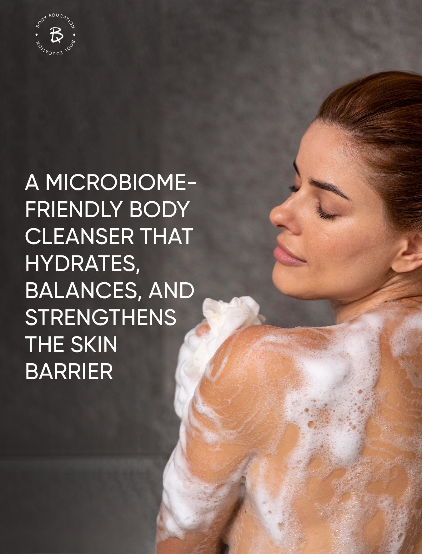 Woman with soapy skin against a dark background with promotional text about a microbiome-friendly body cleanser.