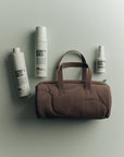 AUTHENTIC BEAUTY CONCEPT Amplify – dárková vlasová sada s kabelkou Soft-Touch Barrel Bag Cocoa Powder

