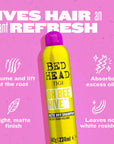 Centered yellow BED HEAD dry shampoo bottle with purple cap and volume/absorb icons