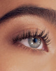 RevitaLash Signature Eyelash Curler Kleštičky na řasy used on beautifully curled eyelashes.